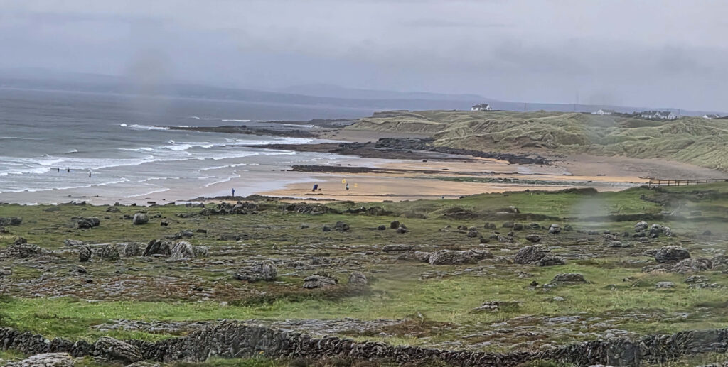 A beach, traditional but abandoned fences -- on the way to Galway, Ireland